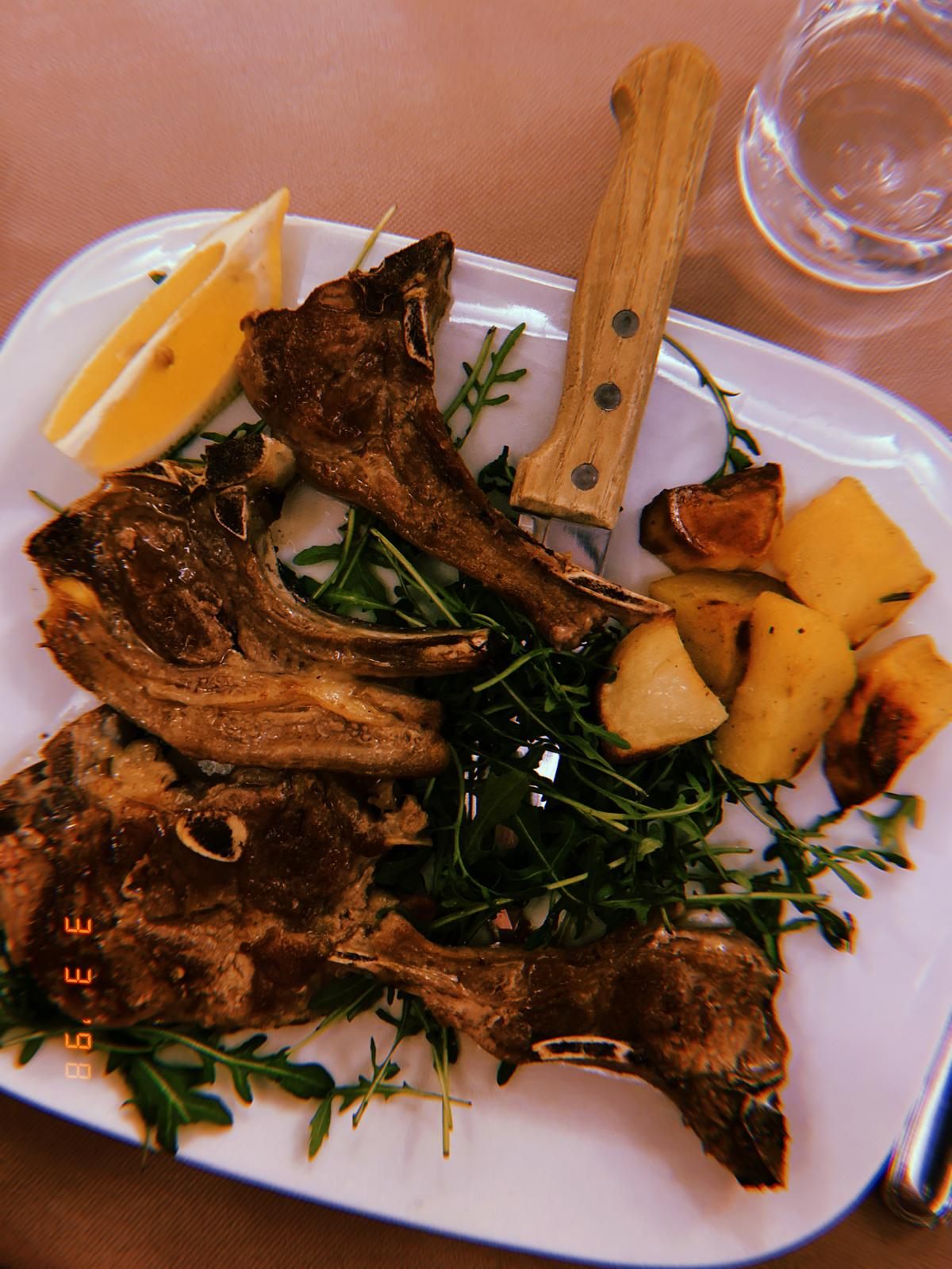 A plate of grilled lamb chops in Rome